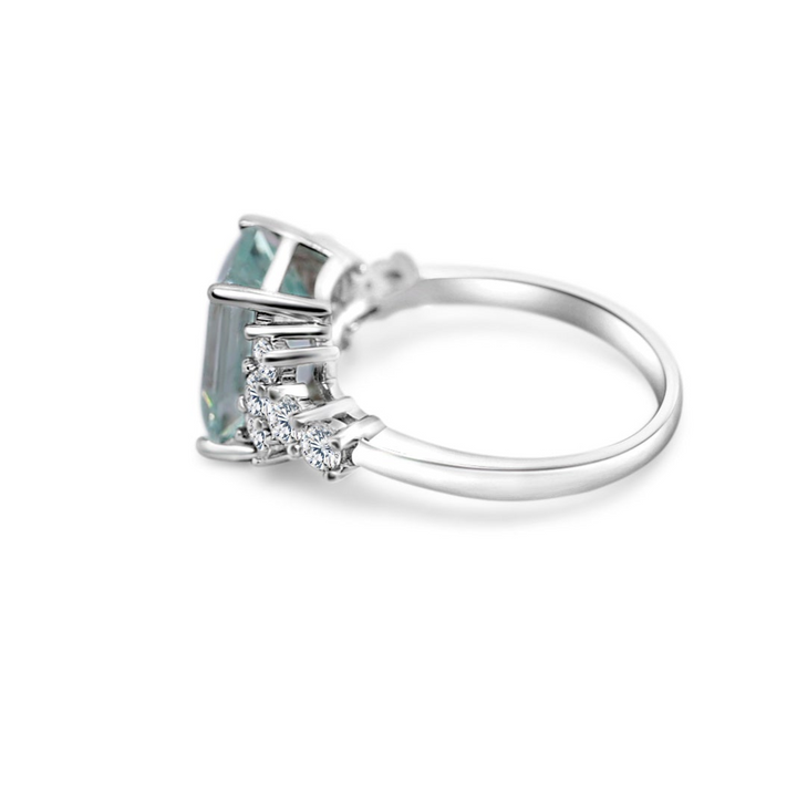Emerald cut aquamarine engagement ring in sterling silver with side stones for a stunning look.