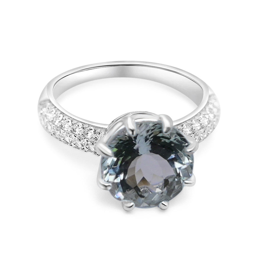 Stunning aquamarine silver ring for women featuring round aquamarine and white CZ stones in rhodium plated sterling silver.