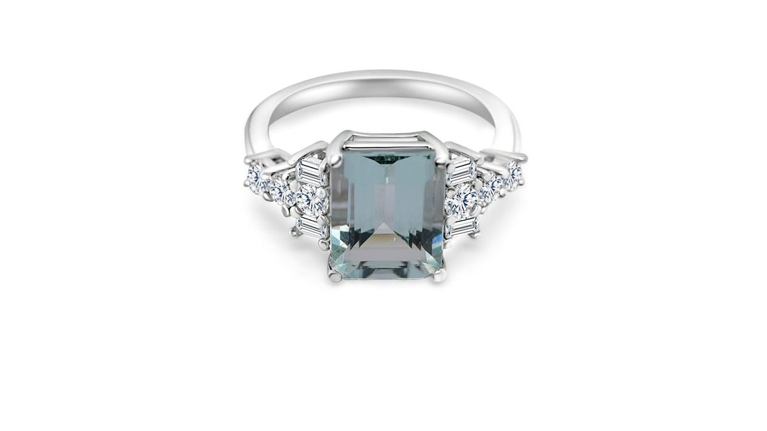 Emerald cut aquamarine engagement ring in sterling silver with side stone accents for a stunning look