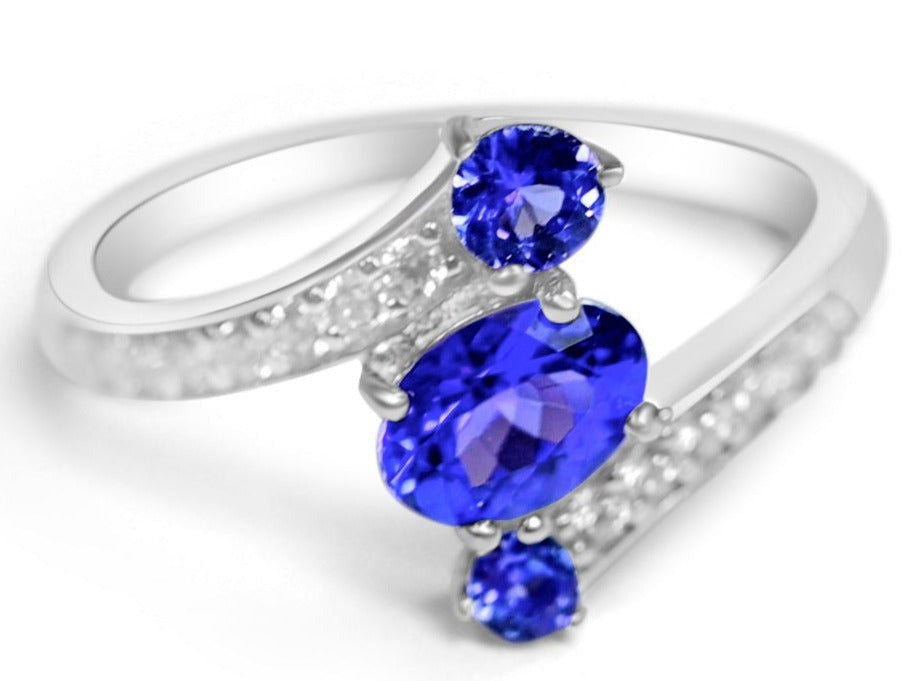 Natural tanzanite three stone ring in sterling silver with oval and round tanzanite gemstones