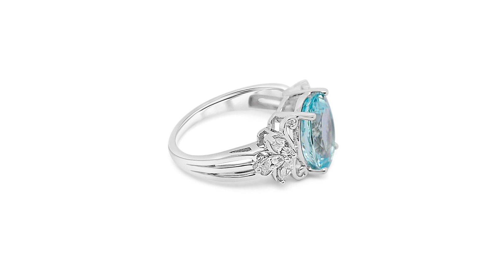 Rhodium plated aquamarine ring for women featuring an oval aquamarine and marquise white CZ accents