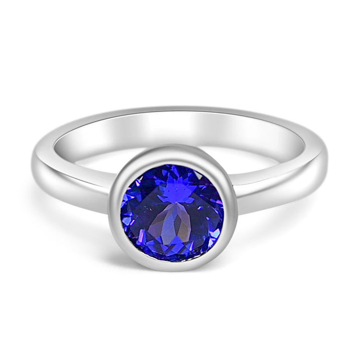 Stylish tanzanite engagement ring in rhodium plated 925 sterling silver with 1.3 carats of tanzanite - Round Tanzanite Rhodium Plated 925 Sterling Silver 1.3 Cts / 3.02 Gm Ring PJC31598R