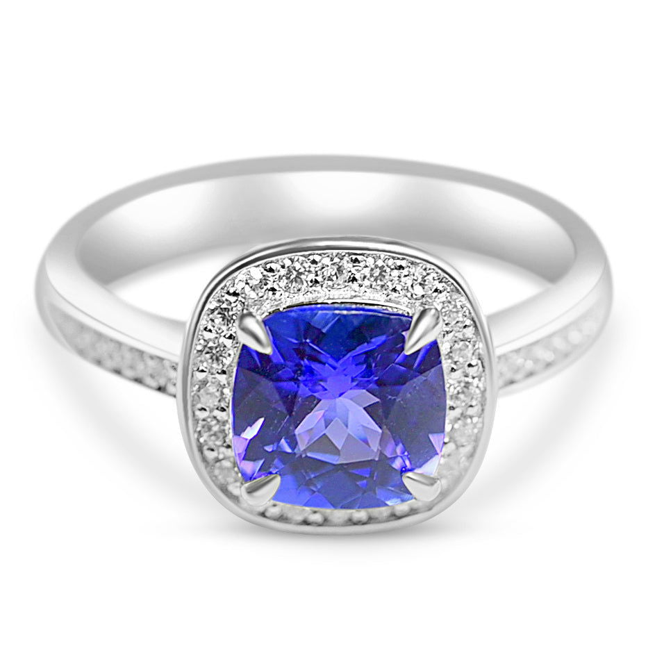 Unique tanzanite engagement ring with cushion tanzanite and round white CZ set in rhodium plated sterling silver