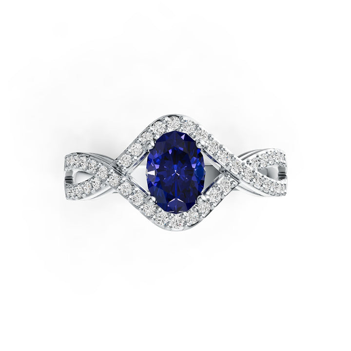 Silver ring with a tanzanite gemstone on a white background 1 - Oval Tanzanite Ring with Diamond Accents in 14K White Gold