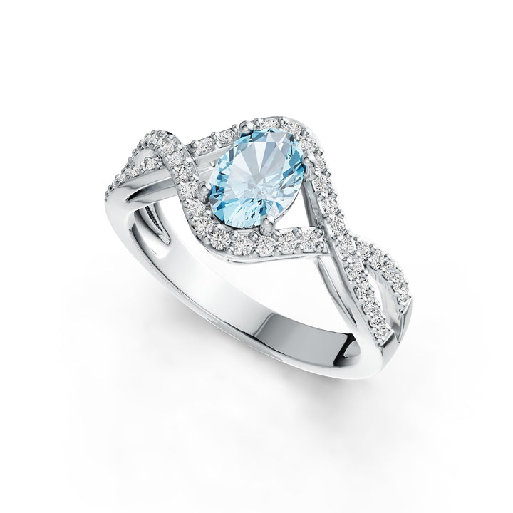 Silver ring with aquamarine gemstone on a white background - Oval Aquamarine and Diamond Ring in 14K Rhodium-Finished Gold